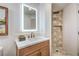 Elegant bathroom boasting a stylish vanity and a beautifully tiled shower at 1144 Calico Ridge Dr, Henderson, NV 89011