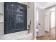 Stylish bathroom with shower/tub combo, blue-tiled accent wall, and modern fixtures at 1144 Calico Ridge Dr, Henderson, NV 89011