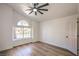 Bright, spacious bedroom with a large window and stylish ceiling fan at 1144 Calico Ridge Dr, Henderson, NV 89011