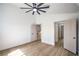 Cozy bedroom with a ceiling fan and multiple doors leading to different areas of the home at 1144 Calico Ridge Dr, Henderson, NV 89011