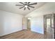 A spacious bedroom with a ceiling fan, closet, and modern flooring at 1144 Calico Ridge Dr, Henderson, NV 89011