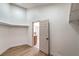 Bright walk-in closet with clothing racks and a view of the bathroom and vanity at 1144 Calico Ridge Dr, Henderson, NV 89011