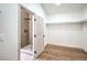 Walk-in closet with a view to the shower, and plenty of space and shelving for organized storage at 1144 Calico Ridge Dr, Henderson, NV 89011