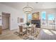 Dining room featuring a fireplace, chandelier, and many windows at 1144 Calico Ridge Dr, Henderson, NV 89011