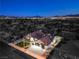 Beautiful exterior elevation highlighting the manicured lawn and well-lit facade, enhancing its curb appeal at night at 1144 Calico Ridge Dr, Henderson, NV 89011