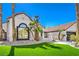 Beautiful exterior view of home showcasing the front yard with palm trees at 1144 Calico Ridge Dr, Henderson, NV 89011