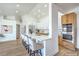Bright kitchen with stainless appliances, eat-in island, and ample counter space at 1144 Calico Ridge Dr, Henderson, NV 89011