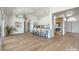 Open floor plan with a modern kitchen featuring stainless steel appliances and island seating at 1144 Calico Ridge Dr, Henderson, NV 89011