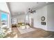 Spacious main bedroom with a four-poster bed, a ceiling fan, and large windows providing natural light at 1144 Calico Ridge Dr, Henderson, NV 89011