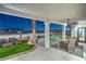 Covered patio with ceiling fan, outdoor seating, and a view of the pool and backyard, perfect for entertaining at 1144 Calico Ridge Dr, Henderson, NV 89011