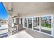 Spacious covered patio with sleek ceiling fan and comfortable seating, perfect for enjoying the outdoor views and fresh air at 1144 Calico Ridge Dr, Henderson, NV 89011