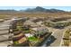 Stunning aerial view of a modern home in a vibrant community with picturesque mountain views in the background at 12413 Alpenglow Ct, Las Vegas, NV 89138