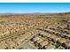 Expansive aerial view of a Primary-planned community in a desert landscape with lush landscaping and modern homes at 12413 Alpenglow Ct, Las Vegas, NV 89138