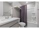 Bathroom featuring vanity with sink, toilet, and shower-tub combination with curtain at 12413 Alpenglow Ct, Las Vegas, NV 89138