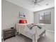 Cozy bedroom featuring a ceiling fan and natural light from the window at 12413 Alpenglow Ct, Las Vegas, NV 89138