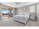 Bedroom with a king bed, sliding glass door to a balcony, and serene natural light at 12413 Alpenglow Ct, Las Vegas, NV 89138