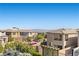 View of the backyard and surrounding neighborhood, with lush landscaping and inviting fire pit at 12413 Alpenglow Ct, Las Vegas, NV 89138