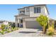 Well-maintained two-story home with a brick driveway, two-car garage, and a lovely landscaped yard at 12413 Alpenglow Ct, Las Vegas, NV 89138