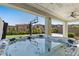 Covered hot tub area with ceiling fans, overlooking a backyard with a basketball court at 12413 Alpenglow Ct, Las Vegas, NV 89138