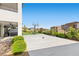 Spacious backyard with basketball court, artificial turf, and lush landscaping at 12413 Alpenglow Ct, Las Vegas, NV 89138