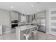 Stylish kitchen with a large island, stainless steel appliances, and modern finishes for cooking at 12413 Alpenglow Ct, Las Vegas, NV 89138