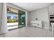 Bright room featuring a white piano, sliding glass doors to the patio and backyard views at 12413 Alpenglow Ct, Las Vegas, NV 89138