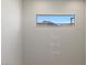 Clean room displaying 'Home Sweet Home' decor on the wall, framed by a window capturing a mountain view at 12413 Alpenglow Ct, Las Vegas, NV 89138