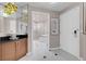 Hallway view of bathroom featuring black counters and a shower at 145 E Harmon Ave # 3801&3803, Las Vegas, NV 89109