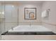 This modern bathtub is surrounded by sleek tile at 145 E Harmon Ave # 3801&3803, Las Vegas, NV 89109