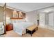 This elegant bedroom boasts soft lighting, a comfortable bed, and a modern kitchenette view to bathroom at 145 E Harmon Ave # 3801&3803, Las Vegas, NV 89109