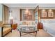 Stylish bedroom features a comfy sofa, glass coffee table, and elegant decor with bedside tables at 145 E Harmon Ave # 3801&3803, Las Vegas, NV 89109