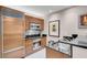 Well-equipped kitchen with stainless steel appliances, ample cabinet space, and breakfast bar at 145 E Harmon Ave # 3801&3803, Las Vegas, NV 89109