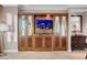 Living room featuring a large entertainment center and elegant furnishings at 145 E Harmon Ave # 3801&3803, Las Vegas, NV 89109