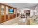 Inviting living room with a large entertainment center, dining area, and comfortable seating at 145 E Harmon Ave # 3801&3803, Las Vegas, NV 89109