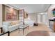 Cozy living area with sofa, glass coffee table, and kitchenette; artwork adds a stylish touch at 145 E Harmon Ave # 3801&3803, Las Vegas, NV 89109
