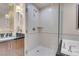 Shower with stone surround and glass door at 145 E Harmon Ave # 3801&3803, Las Vegas, NV 89109