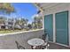 Inviting balcony area featuring a small table with chairs, a relaxing spot to enjoy the weather at 1455 E Katie Ave # D17, Las Vegas, NV 89119