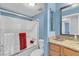 Bathroom featuring a shower and tub combination, toilet, and granite counter with a wood vanity at 1455 E Katie Ave # D17, Las Vegas, NV 89119