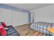 Spacious bedroom featuring wood floors, natural light, and a double-door closet at 1455 E Katie Ave # D17, Las Vegas, NV 89119