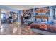 Spacious bedroom with hardwood floors, a decorative accent wall, and a mirrored closet at 1455 E Katie Ave # D17, Las Vegas, NV 89119
