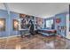 Bedroom featuring hardwood floors, decorative wall, and a desk with monitors at 1455 E Katie Ave # D17, Las Vegas, NV 89119