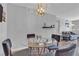 Bright dining room featuring a modern chandelier and an open floor plan at 1455 E Katie Ave # D17, Las Vegas, NV 89119