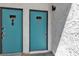 A pair of vividly colored doors in a building with stucco walls at 1455 E Katie Ave # D17, Las Vegas, NV 89119