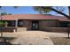 Community building with a brick facade, a brown roof, and a paved walkway at 1455 E Katie Ave # D17, Las Vegas, NV 89119