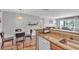 Kitchen open to dining room and living area featuring granite countertops at 1455 E Katie Ave # D17, Las Vegas, NV 89119