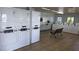 Spacious laundry room with multiple washers and dryers plus seating at 1455 E Katie Ave # D17, Las Vegas, NV 89119