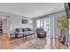 Cozy living room with hardwood floors, stylish furnishings, and lots of natural light at 1455 E Katie Ave # D17, Las Vegas, NV 89119