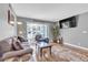 Inviting living room with hardwood floors, gray walls and comfortable seating at 1455 E Katie Ave # D17, Las Vegas, NV 89119