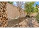 Shady backyard with a hammock for relaxation, complemented by mature trees and stone landscaping at 1532 Via Cassia, Henderson, NV 89052