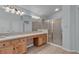 Bathroom with dual sinks, a shower, and a large vanity at 1532 Via Cassia, Henderson, NV 89052